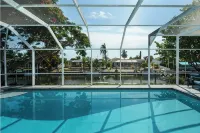Canalfront Retreat! 2BR + Bunk Nook, Pool & Boat Dock – Easy Water Access!