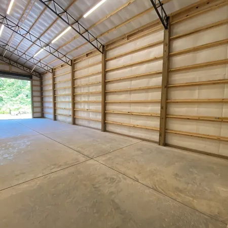 TAKE IT EASY Fishing Cabin. Large enclosed bay for storing the boat.