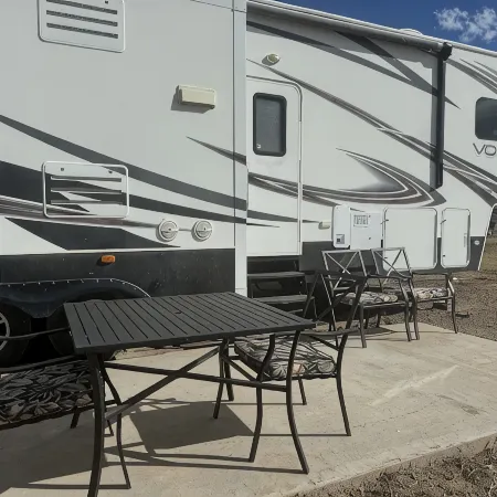Cozy RV tucked back in a quiet property with plenty of room to relax