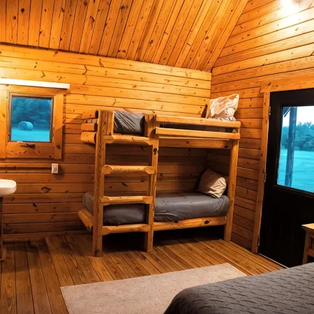 Charming cabin with loft, porch swing, AC, and WiFi on 295-acre peaceful retreat