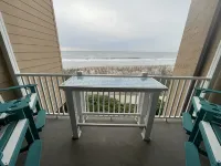 Enjoy an oceanfront getaway with beautiful beach steps from your door. - balcony