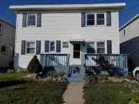 Charming Beach block getaway! Leave your sheets, towels at home! You're on VACA! Hoteles en Brigantine