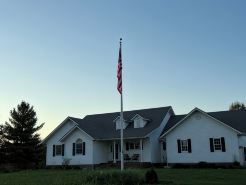 Fully custom modern four bedroom home on 13 acres with a stocked pond.