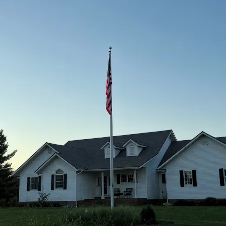Fully custom modern four bedroom home on 13 acres with a stocked pond.