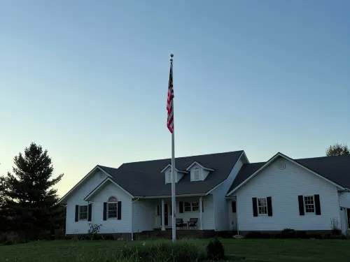 Fully custom modern four bedroom home on 13 acres with a stocked pond.