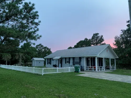 Ground level home steps from the beach in Waveland - 4-Star