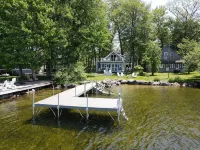 Relax in Raymond's lakefront 2-bedroom vacation home, just steps to Sebago Lake
