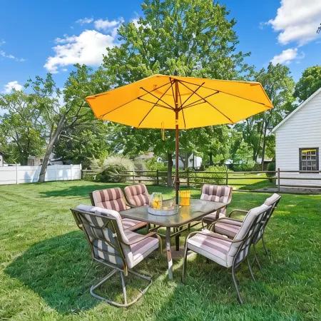 High-end home w/ fireplace, gourmet kitchen, sauna, game rm/ large yard/fire pit