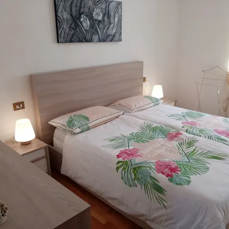 Apartment Agnese with lake view, swimming pool, garage and private garden.