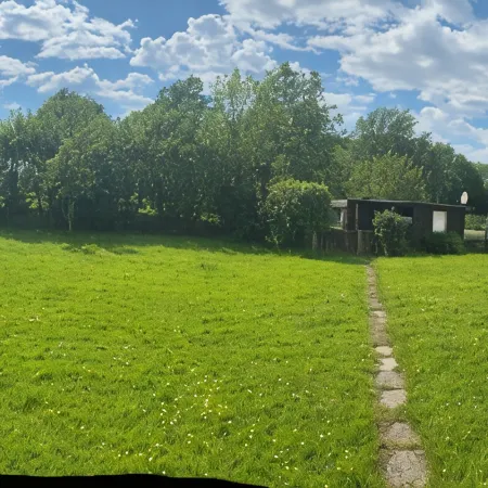 Kleine Ferienwohnung , Direkt am Deich und Hafen von Eckwarden mit Gartennutzung