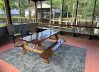 BEAUTIFUL WATERFRONT .  GNAT SCREENED BOATHOUSE AND AJOINING COVERED BOAT SLIPS
