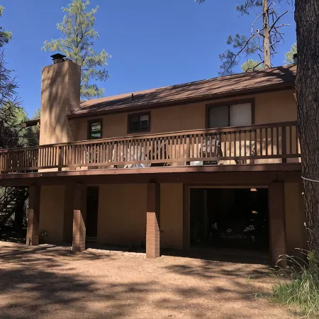 Privacy! One  & 1/2 acre with wrap around deck. Backs the National Forest.