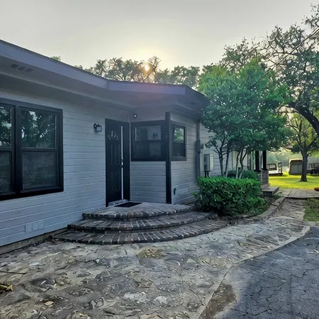 Newly Renovated 1.5 Acre Lake Front Home with Game Room and Direct Lake Access.