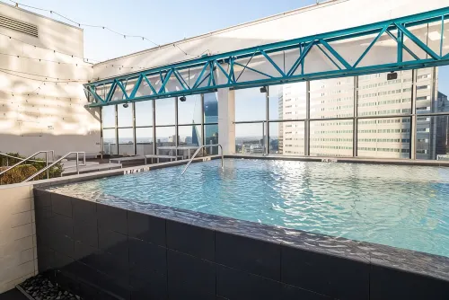 Cozy Retreat with Rooftop Pool, Parking, and Spacious Comfort - Condos