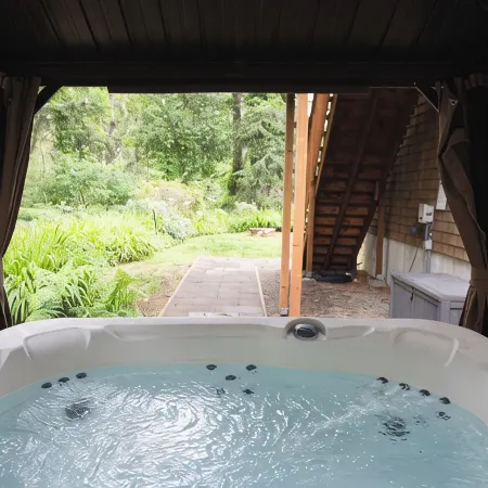 private hot tub, fun game room, cozy beach house