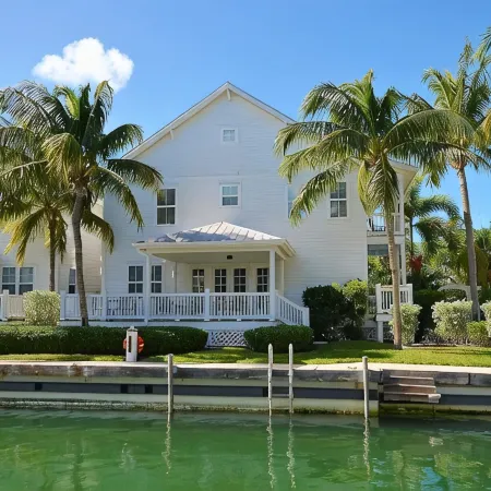 Coral Lagoon Updated Single Family Home with 40' Boat Slip Directly Behind Home