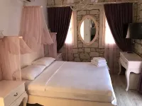 Alacati Alaris Hotel - سرير ووجبة إفطار