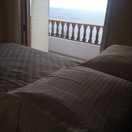 MAGNIFICENT OCEAN VIEW Hamilton Cove Condo With Golf Cart Included.