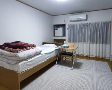 曙光感旅館 飯冢市酒店