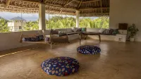 Dive in to our pool and feel the breeze at Mbibo House in the Shela sand dunes - Homestays