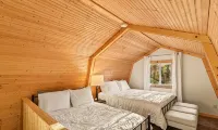 Picturesque 3-bedroom Cabin Hideaway in a wooded setting with a lake view!