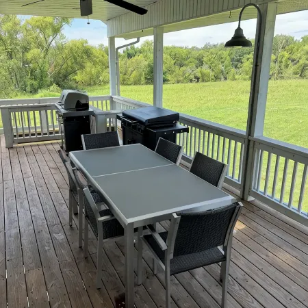 Fully custom modern four bedroom home on 13 acres with a stocked pond.