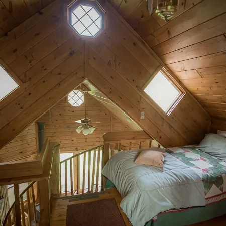 Spiral Staircase Leads To The Lofted Bedroom And Overlooks The Birch Woods.