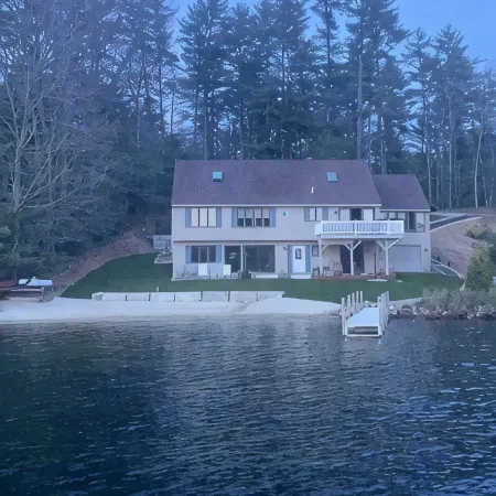 A quiet cove, the sunset and a sandy beach, on Lake Winnipesaukee
