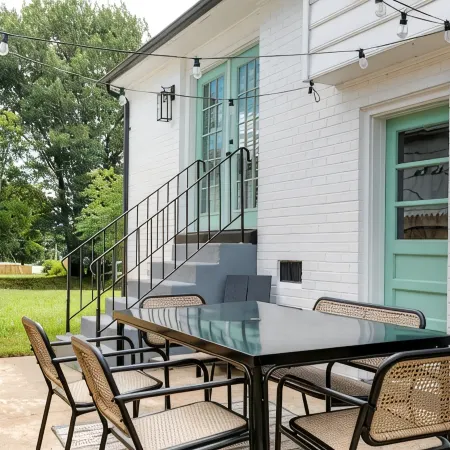 Stylish 4 bedroom house with outdoor dining and fenced backyard.