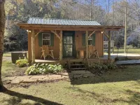 Peaceful cabin in secluded mountain spot beside a picturesque creek