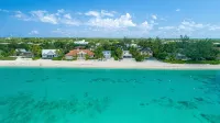 7 Mile Beach Beach Penthouse. Ocean views from Roof Terrace and a Pool Pavilion - 4-Star