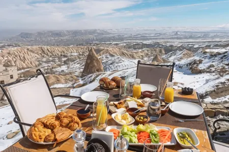 Millstone Cave Suites Hotel Отели в г. Tekelli Mahallesi