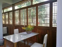 Xishuangbanna Nanshanyin Chayuanli Guesthouse - พร้อมอาหารเช้า