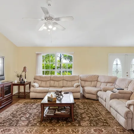Fenced, private, family friendly villa with exotic poolside views near airport.