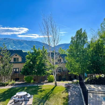 Ski & Lake Family Mountain Condo! Steps to Hot Tub, Sauna, Pool & 3 Ski Resorts