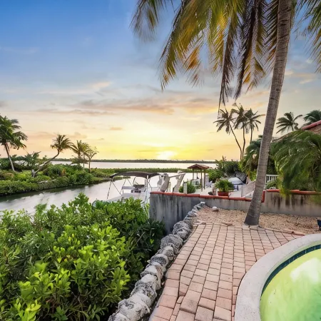 Waterfront Home with a Large Dock, Pool, and Deck Area. Can Accommodate Pets.