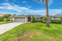 Newly Remodeled 4BR/3BR Canal Front Retreat w/ Pool Near Golf Course & Beach FL - 4-Star