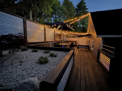 Spacious home near Torch Lake w/custom back patio, steps away from public access - 4-Star