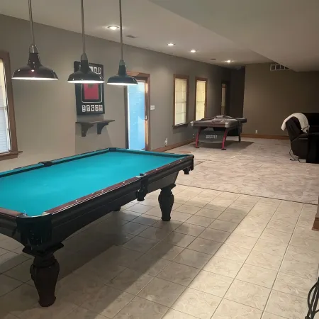 Fully custom modern four bedroom home on 13 acres with a stocked pond.