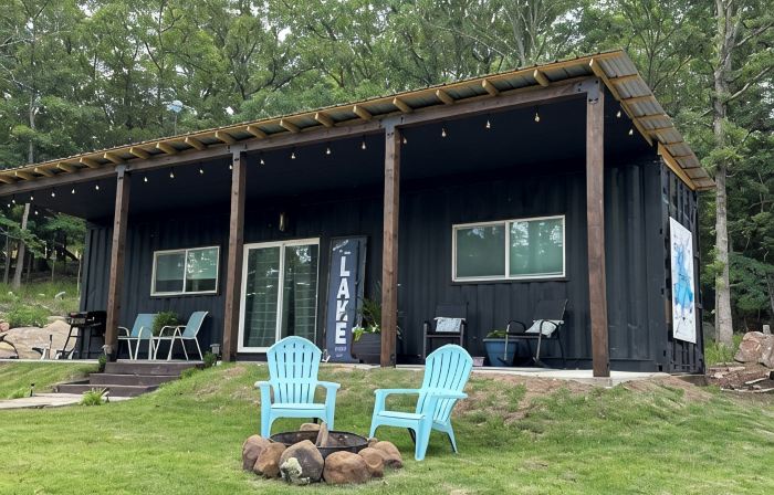 Charming shipping container home with lake view and boat ramp.