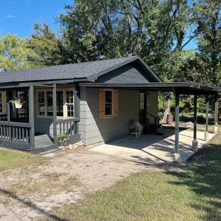 Snuggle up and relax with the whole family at this Ava home.