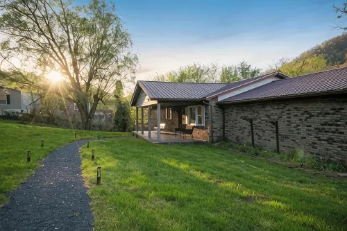 Scenic Riverfront Escape: Game Room, Fire Pit, King Bed - 4-Star