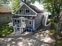 Relax in Raymond's lakefront 2-bedroom vacation home, just steps to Sebago Lake