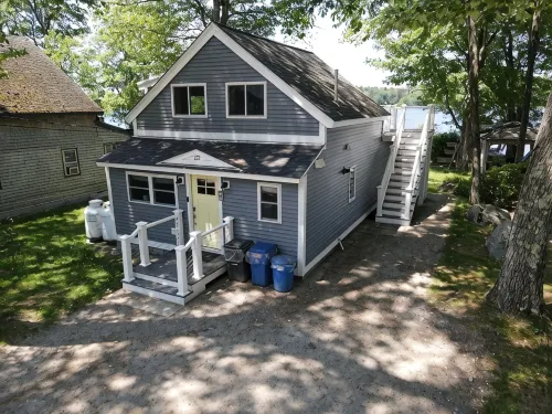 Relax in Raymond's lakefront 2-bedroom vacation home, just steps to Sebago Lake - WiFi