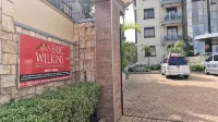 Eric Wilkins Apartments - Bãi đậu xe