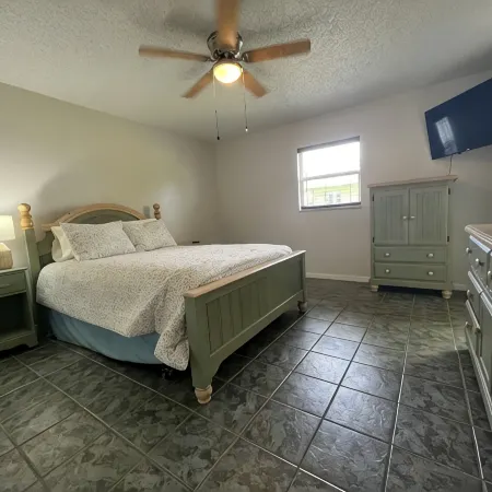 Spacious home directly on Lake Grassy canal. Boat house, hot tub & pool table