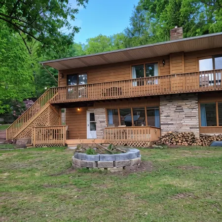 Spacious and cozy home with gas fireplace, boat dock, and lake views