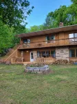 Spacious and cozy home with gas fireplace, boat dock, and lake views
