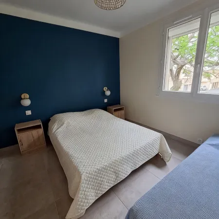 Apartment with balcony upstairs of a villa 300 m from the sea