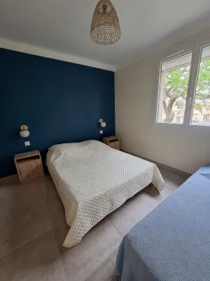 Apartment with balcony upstairs of a villa 300 m from the sea